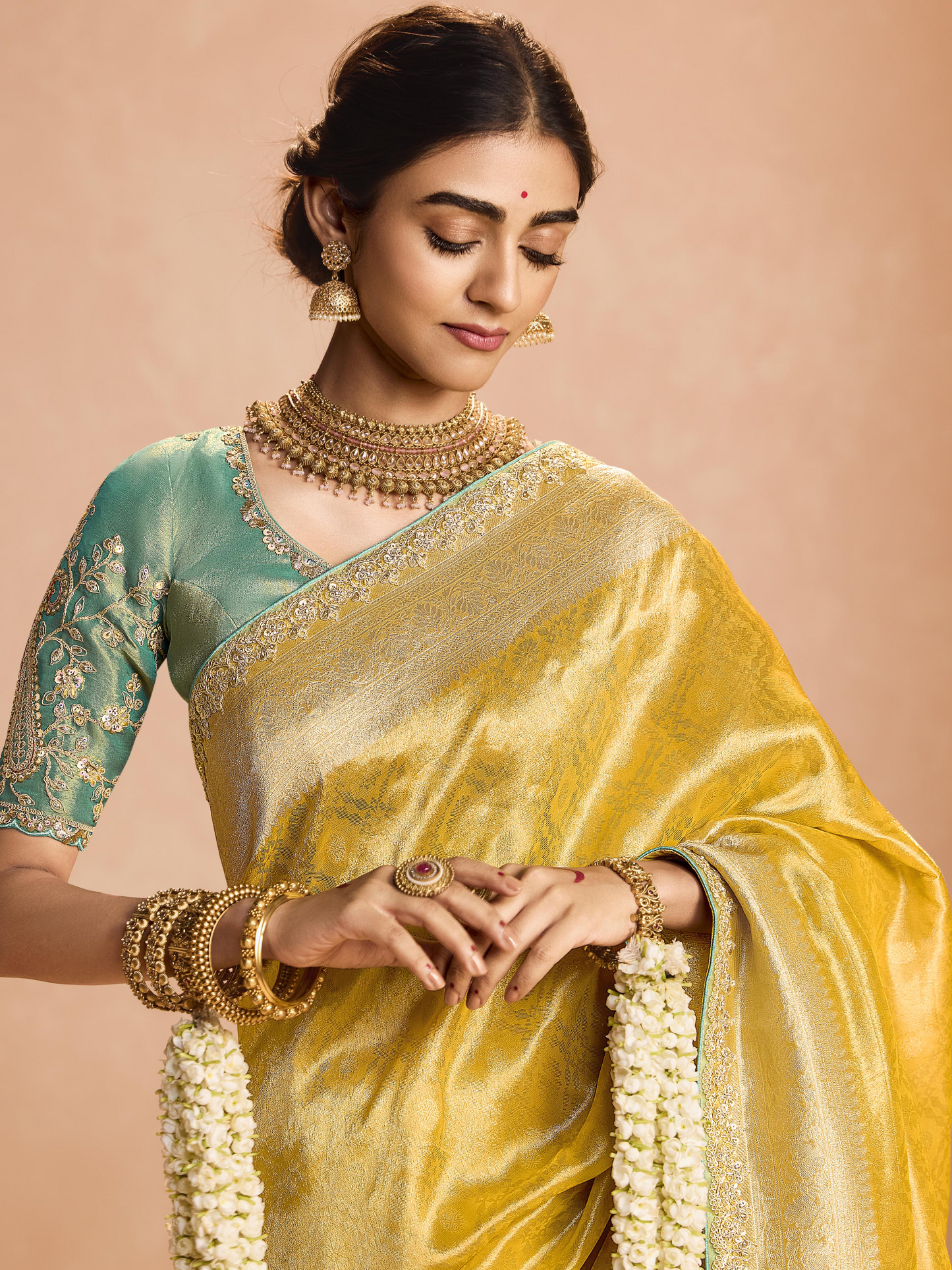 Dhiyona KM Women Yellow Kanjivaram Silk Saree With Sea Green Embroidered Blouse