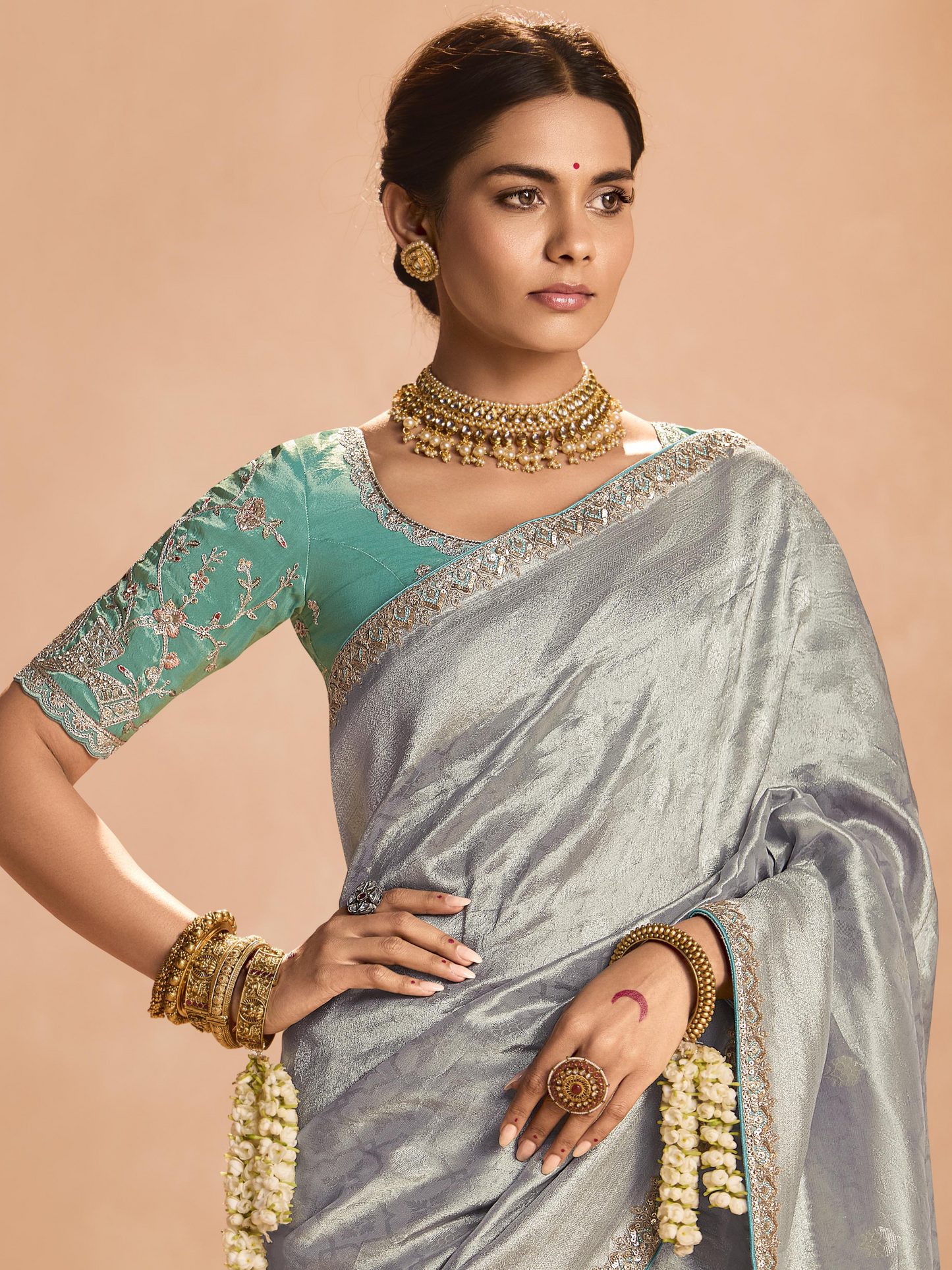 Dhiyona KM Women Elegant Silver Kanjivaram Silk Saree With Sea Green Embroidered Blouse
