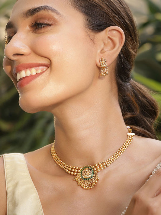 Dhiyona RJ Women's 22K Gold Plated Emerald Studed Gold Beaded Goddess Laxmi Motif Temple Jewellery Set