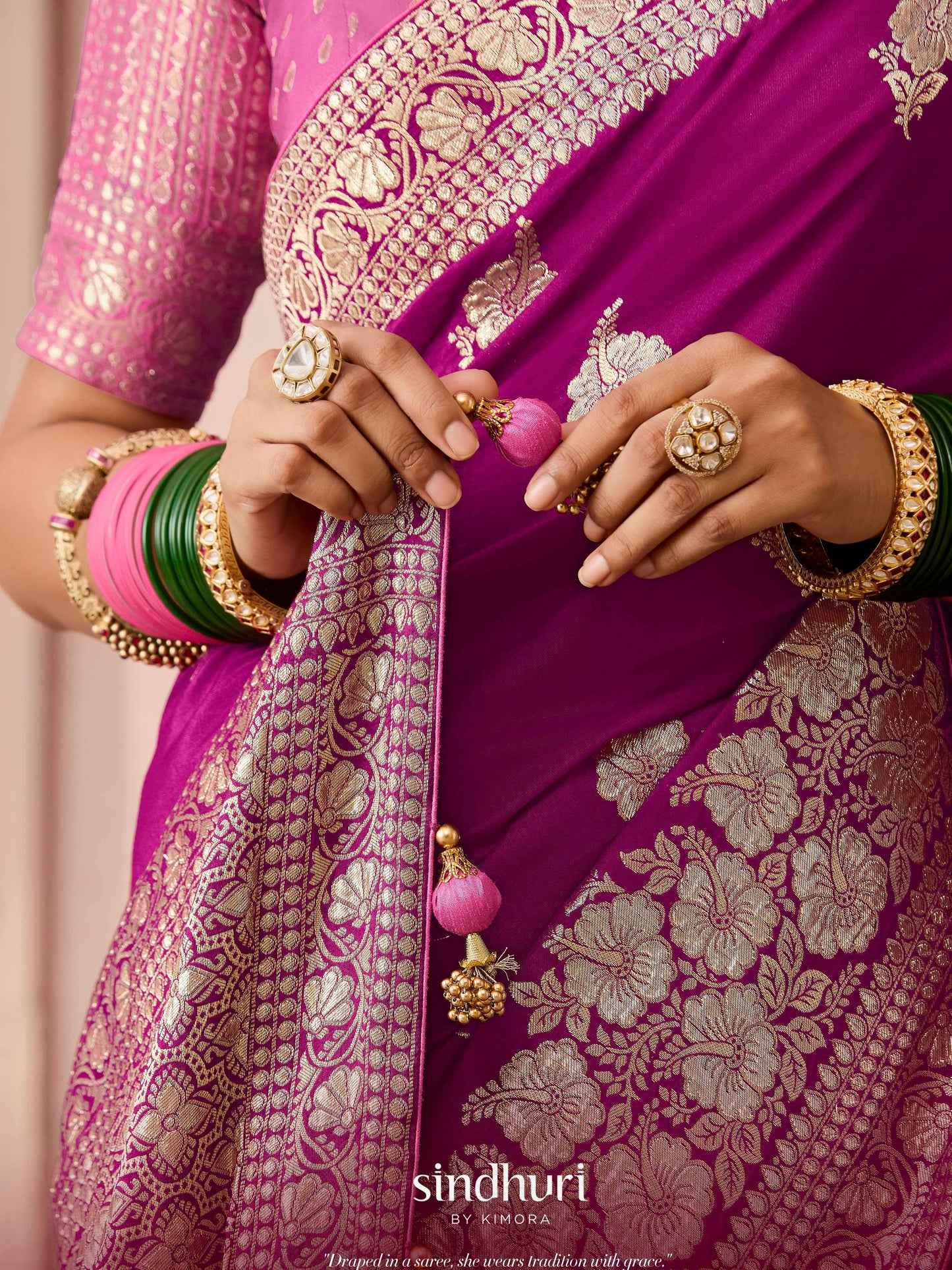 Dhiyona KM Women Purple Dola Silk Saree With Pink Golden Embroidered Blouse
