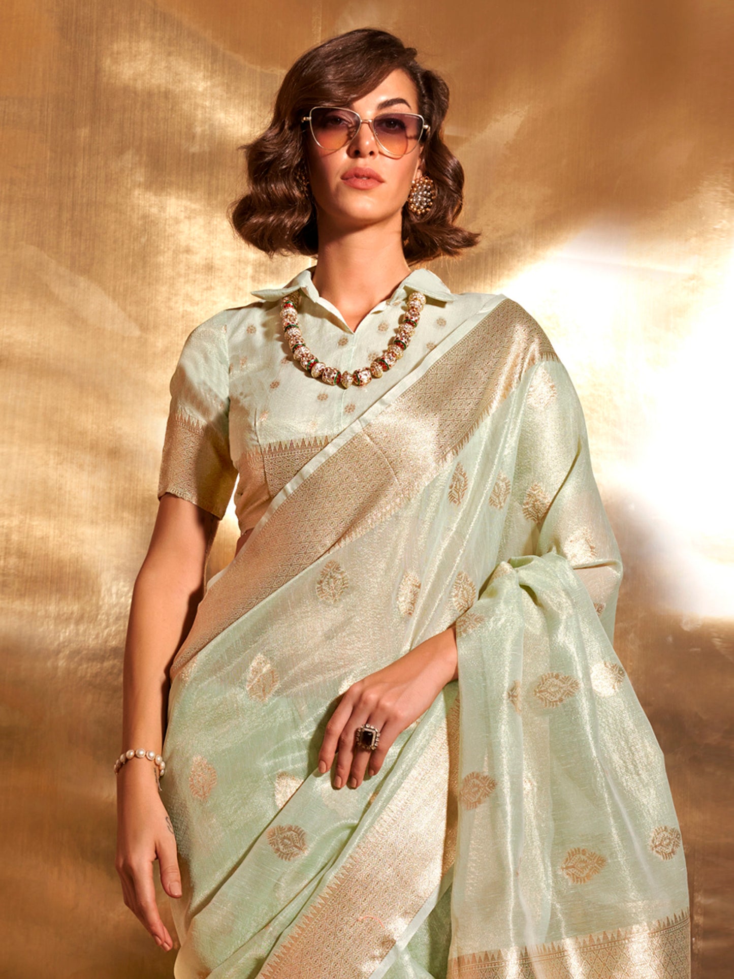 Women's Tissue Sea Green Woven Design Designer Saree With Blouse Piece