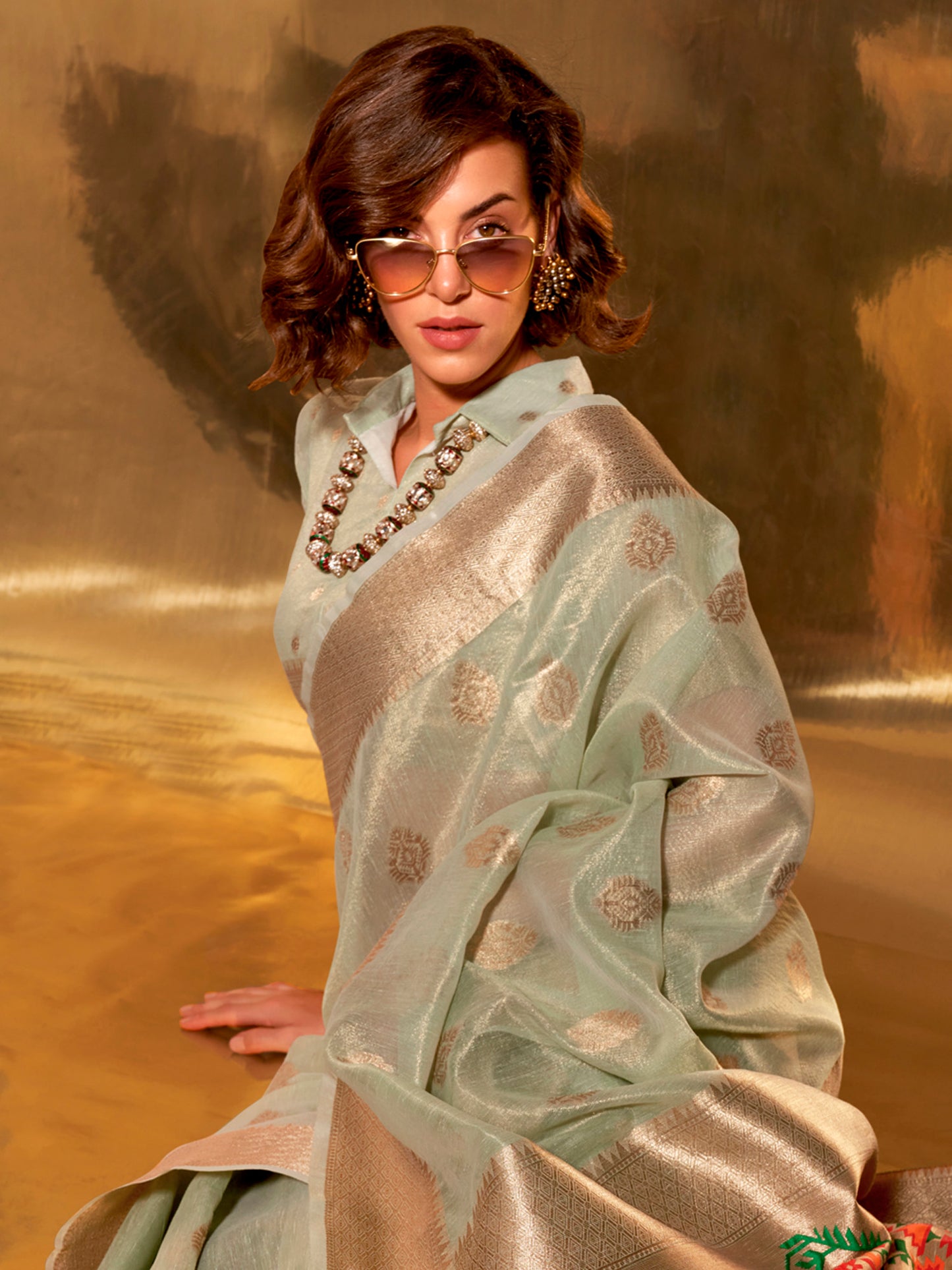 Women's Tissue Sea Green Woven Design Designer Saree With Blouse Piece