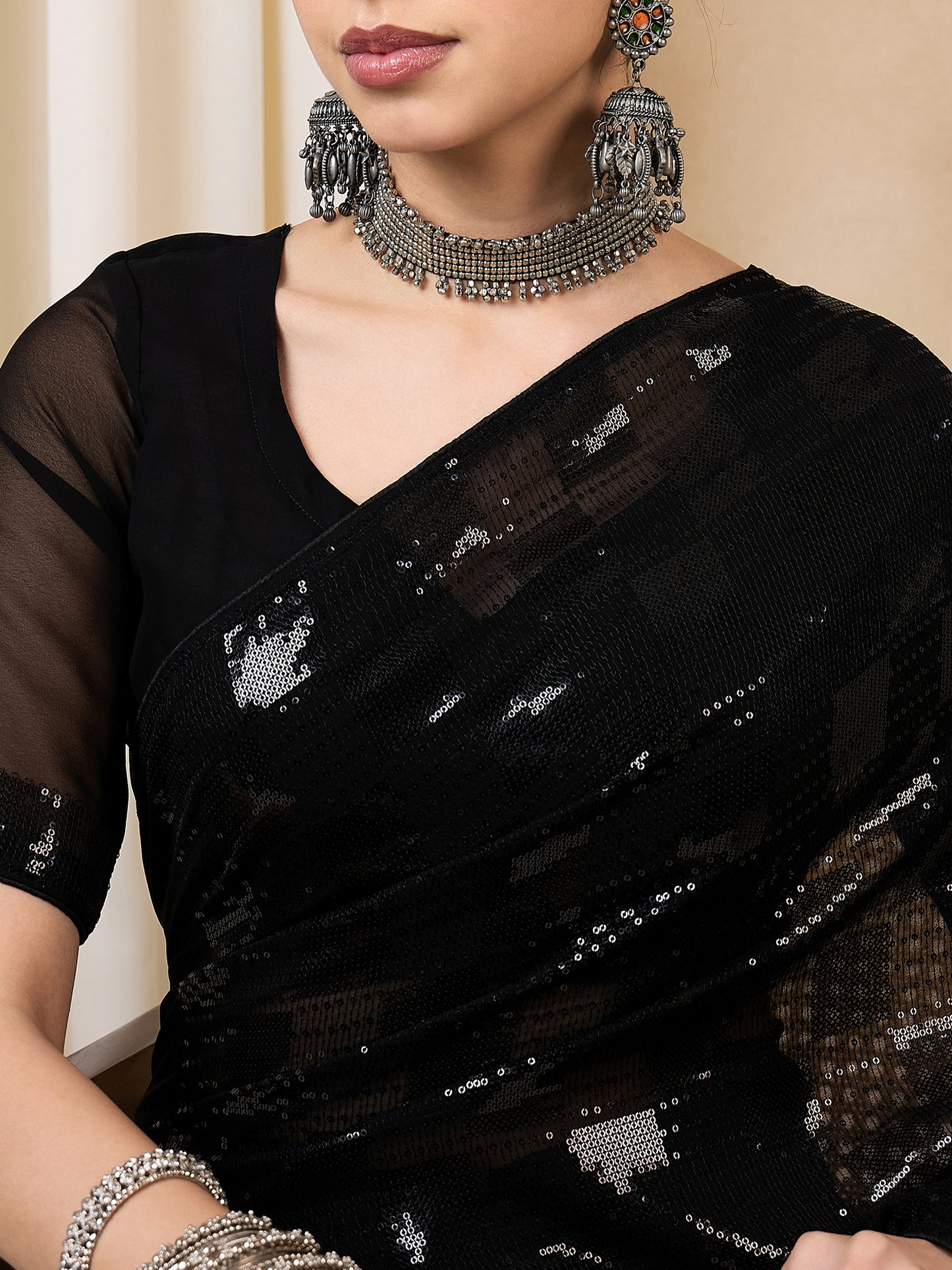 Dhiyona RV Women's Elegant Black Sequins Embroidered Georgette Saree with Matching Blouse ( KVD2110 )