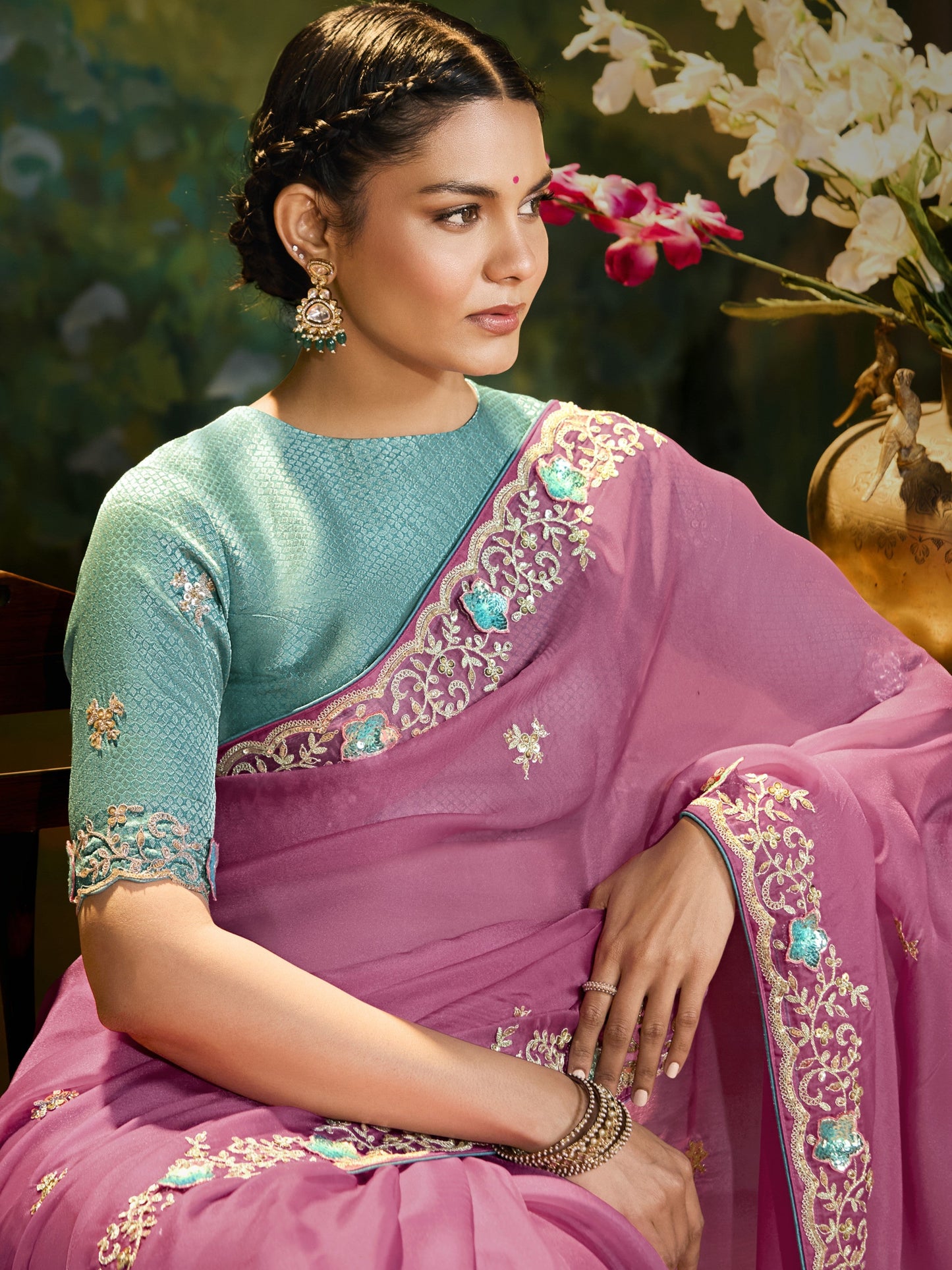 Dhiyona KM Women The Pink Silk Saree With Teal Blouse