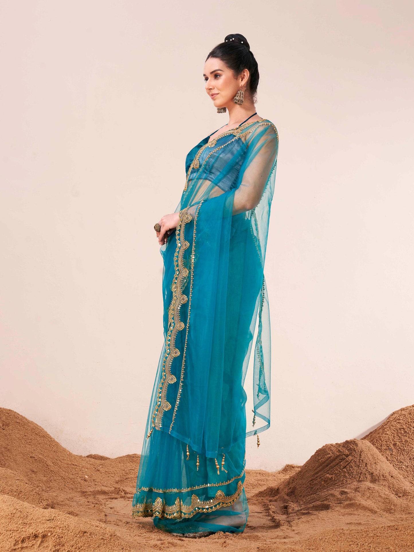 Dhiyona TI Women's Firozi Colored Net Embellished Saree with Unstitched Blouse