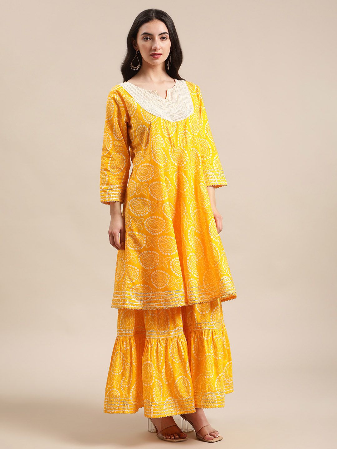 Dhiyona VA Women's Mustard And White Bandhej Printed Flared Kurti With Sharara With Dupatta.