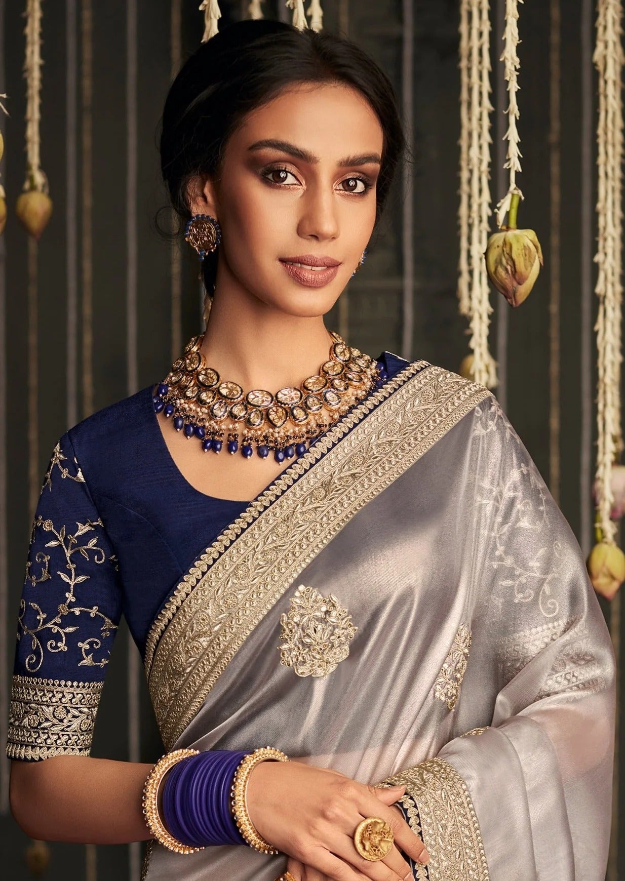Dhiyona KM Women Soft Tissue Silk Saree With Intricate Silver Embroidery & Contrast Blue Blouse