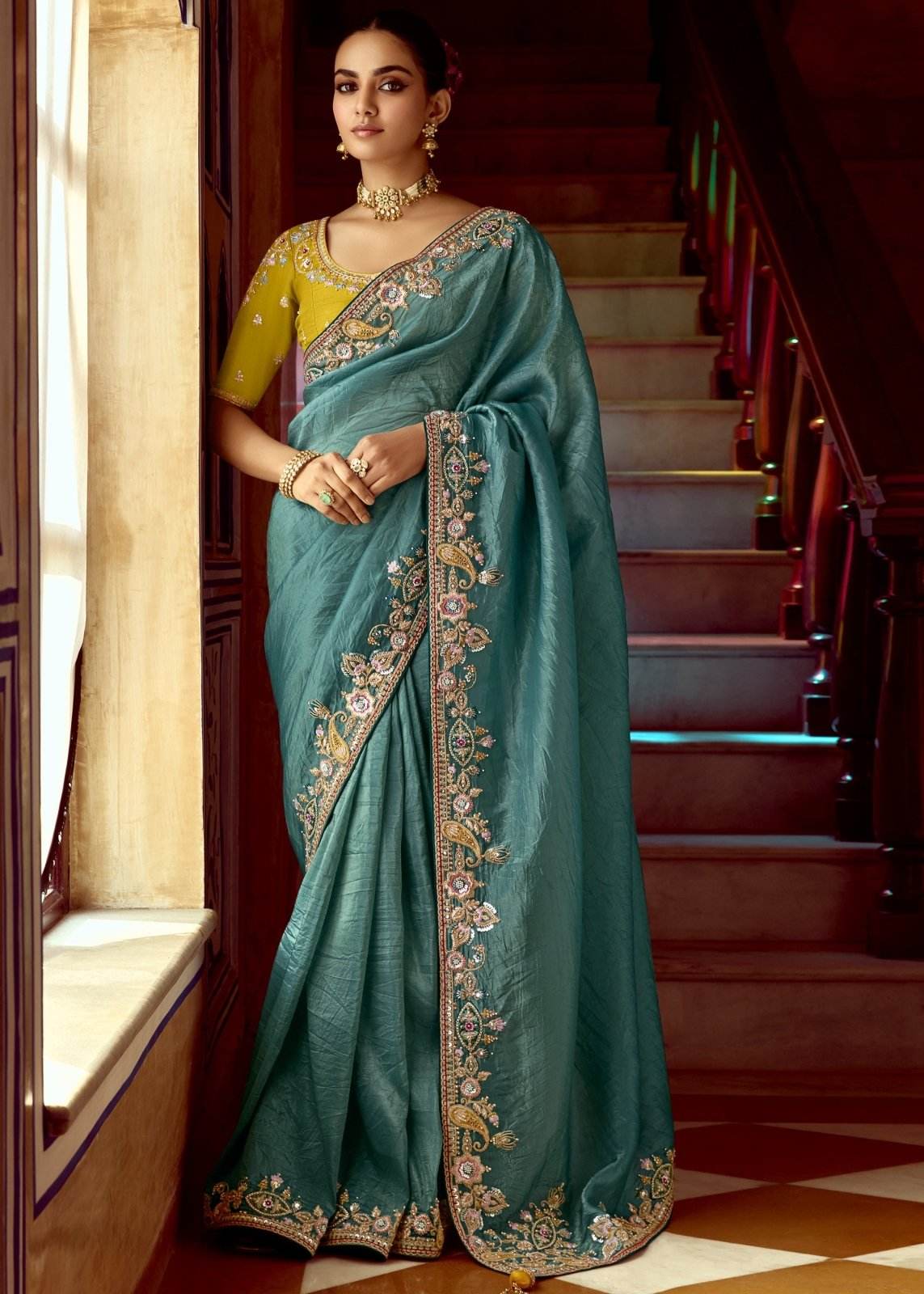Dhiyona KM Women Teal Designer Tissue Silk Saree