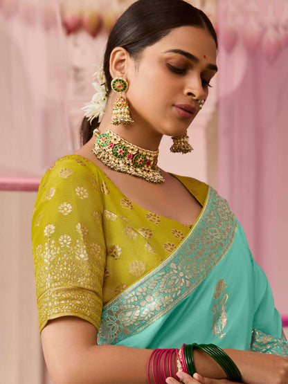 Dhiyona KM Women Sea Green Dola Silk Saree With Yellow Golden Embroidered Blouse