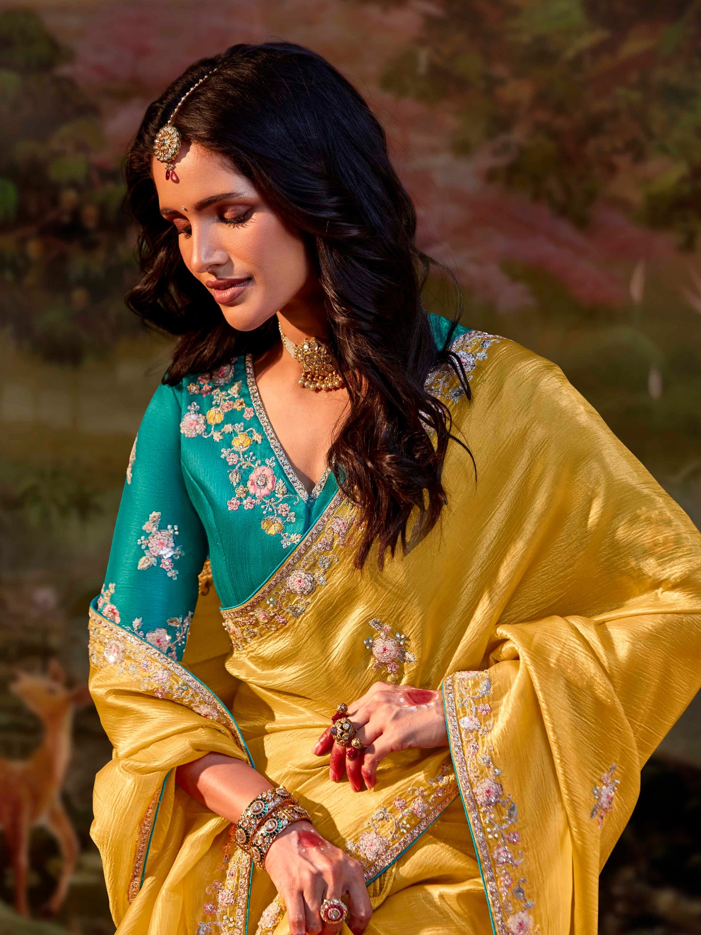 Dhiyona KM Women Yellow Silk Embroidered Butta Saree With Teal Blouse