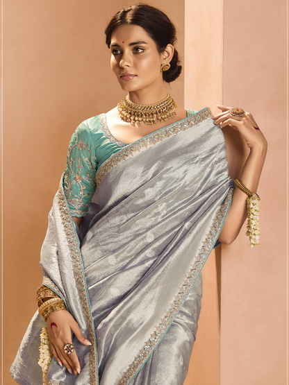 Dhiyona KM Women Elegant Silver Kanjivaram Silk Saree With Sea Green Embroidered Blouse