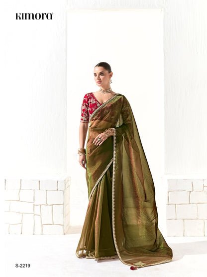 Dhiyona KM Women Mahendi Green Tissue Silk Saree With Red Blouse “ Inspired By Tradition & Bold Elegancemahendi Green Tissue Silk Saree With Red Blouse