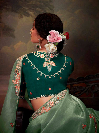Dhiyona KM Women Regal Sea Green Tissue Silk Saree With Intricately Embroidered Bottle Green Blouse