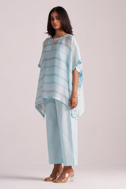 Woman wearing a Misty Blue Silk Kaftaan Co-ord Set on a plain background