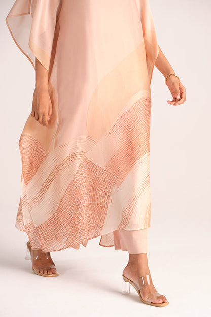 Woman wearing a Spanish Villa Silk Kaftaan Co-ord Set on a plain background