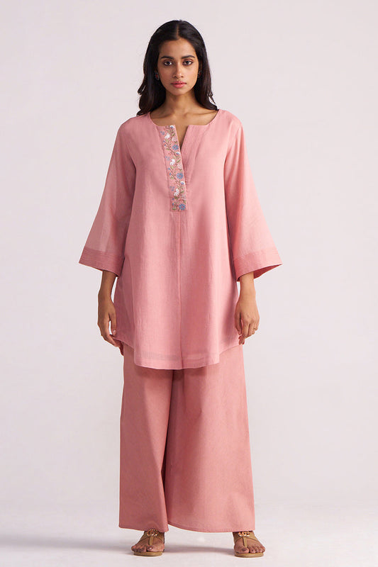 Woman wearing a Rose Tan Mul-Mul Co-ord Set on a light pink background