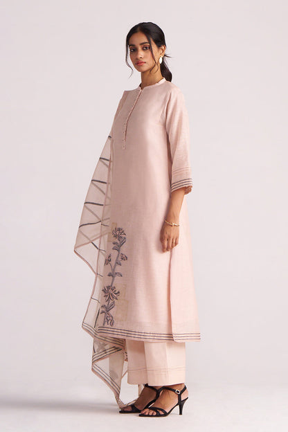 Woman wearing a Sepia Rose Woven Chanderi Kurta Set outfit with floral embroidery on a white background