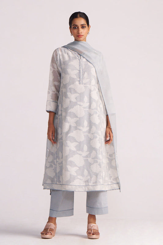 Woman wearing a Grey Woven Pheran Kurta Set on a white background
