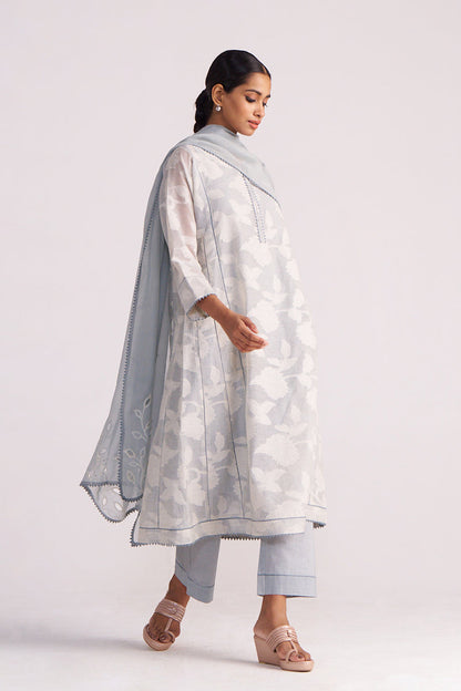 Woman wearing a Grey Woven Pheran Kurta Set outfit on a white background