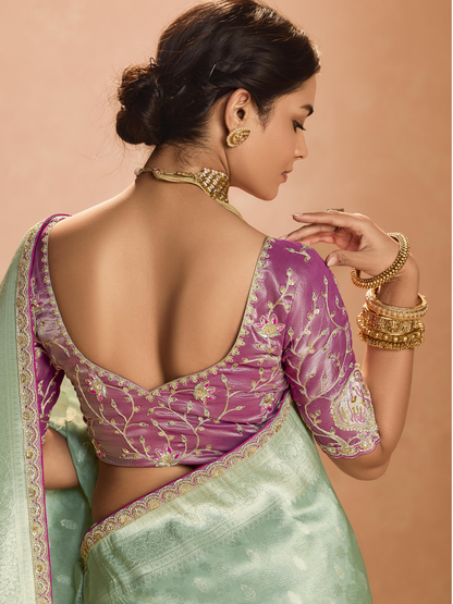 Dhiyona KM Women Mint Green Kanjivaram Silk Saree With Elegant Purple Embroidered Blouse “ A Dreamy Delight
