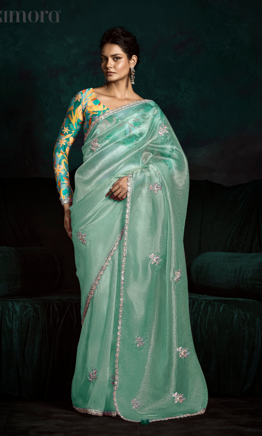 Dhiyona KM Women Teal Designer Organza Saree  “ A Blush Of Elegance