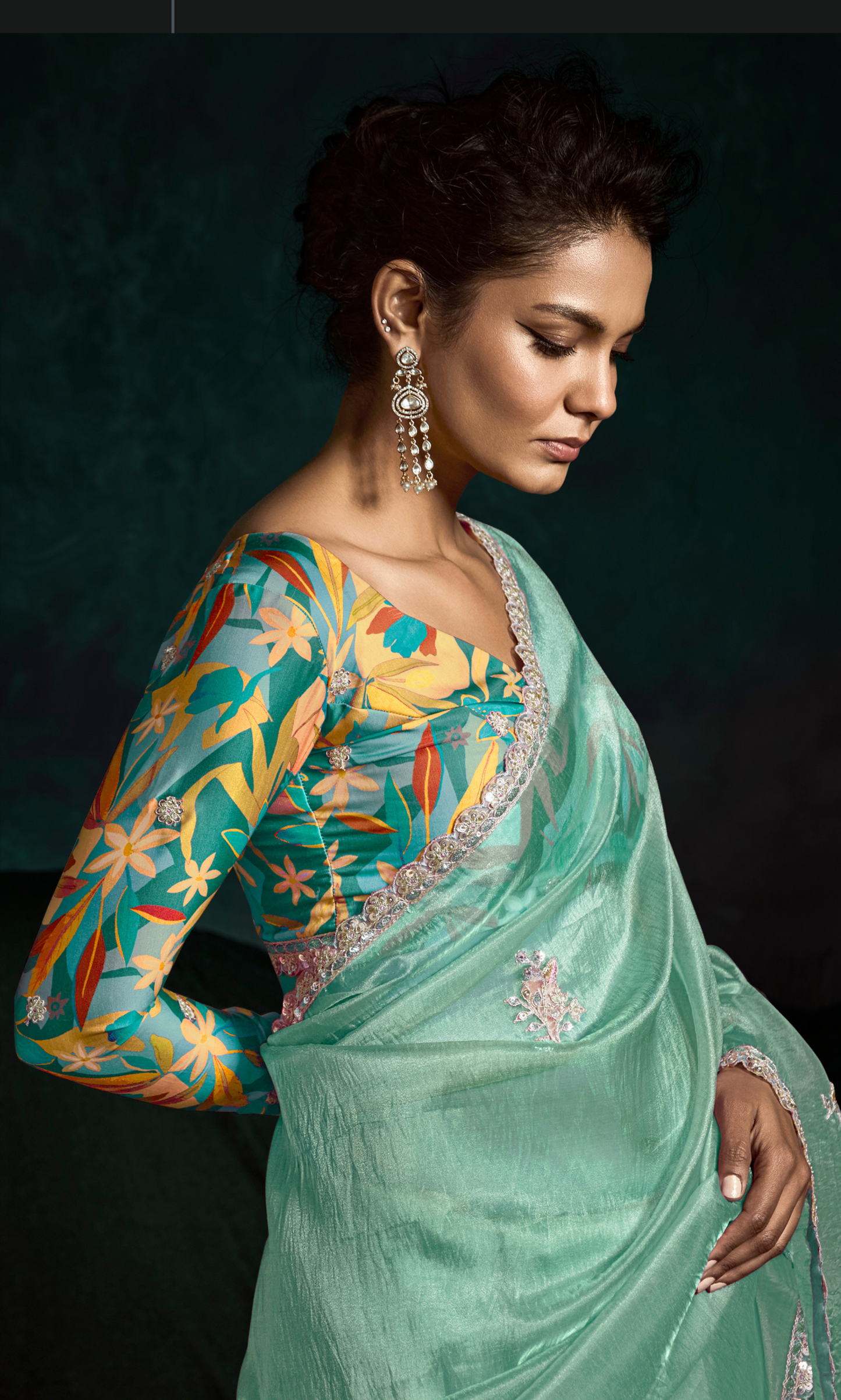Dhiyona KM Women Teal Designer Organza Saree  “ A Blush Of Elegance
