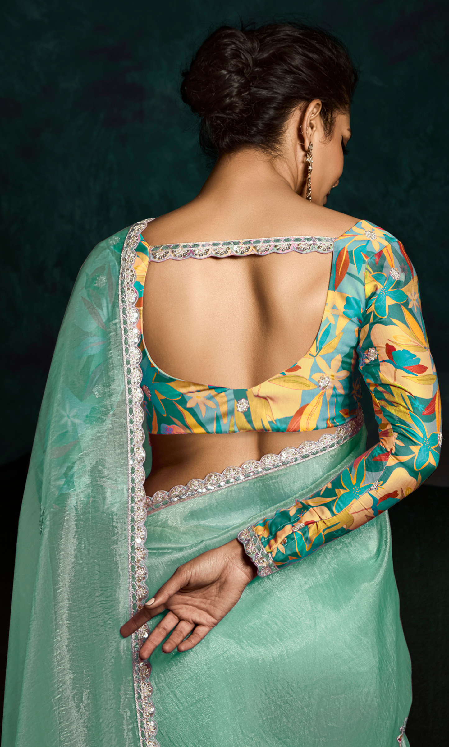Dhiyona KM Women Teal Designer Organza Saree  “ A Blush Of Elegance