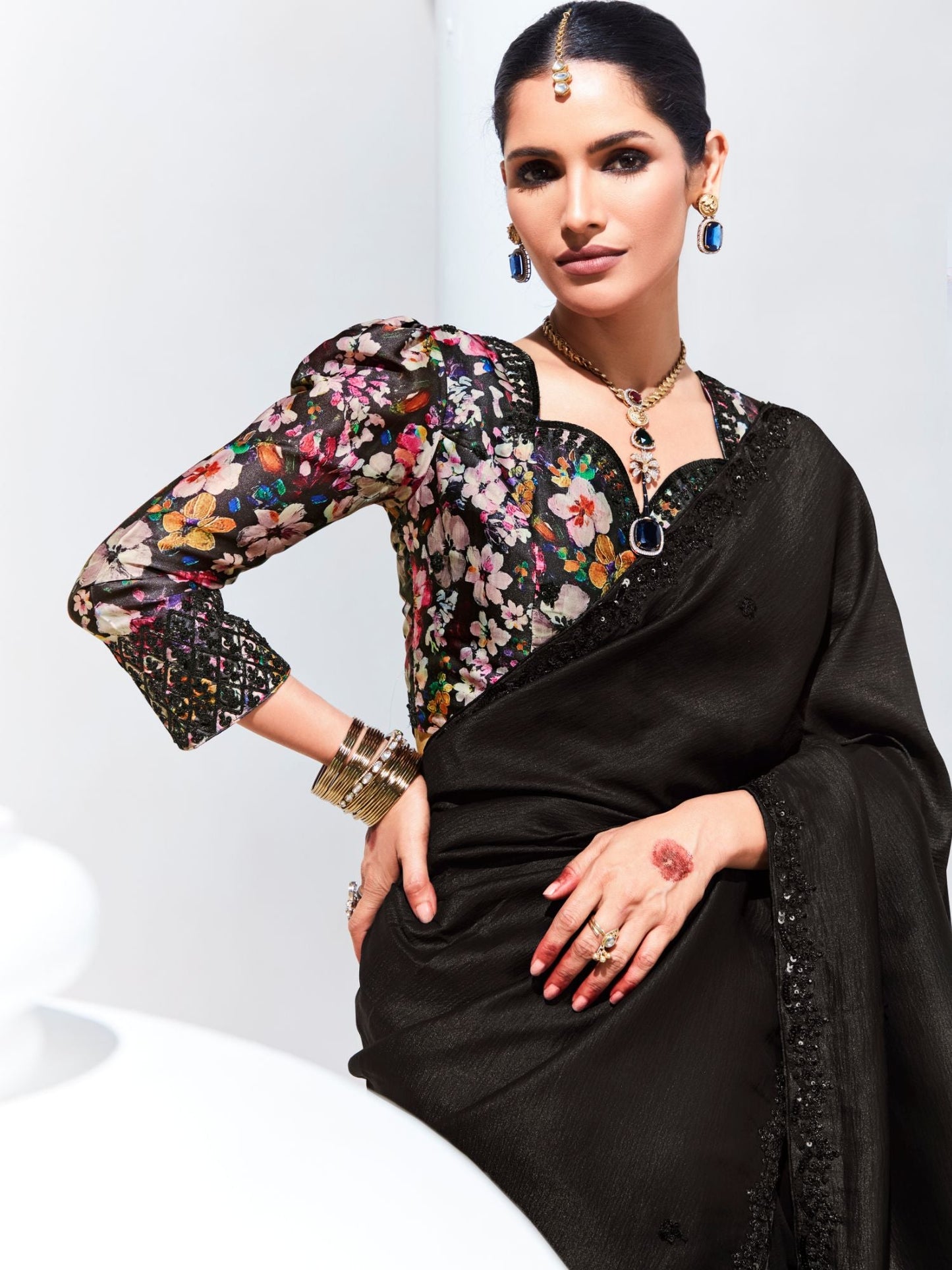 Dhiyona KM Women Black Saree With Floral Embroidered Blouse