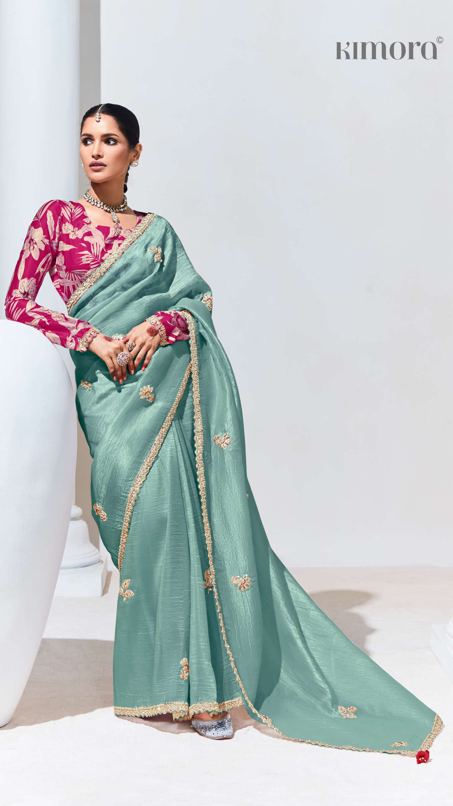 Dhiyona KM Women Teal Pure Tissue Silk Saree With Crushed Finish & Contrasting Red Blouse