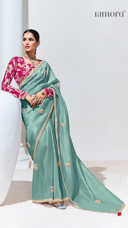 Dhiyona KM Women Teal Pure Tissue Silk Saree With Crushed Finish & Contrasting Red Blouse