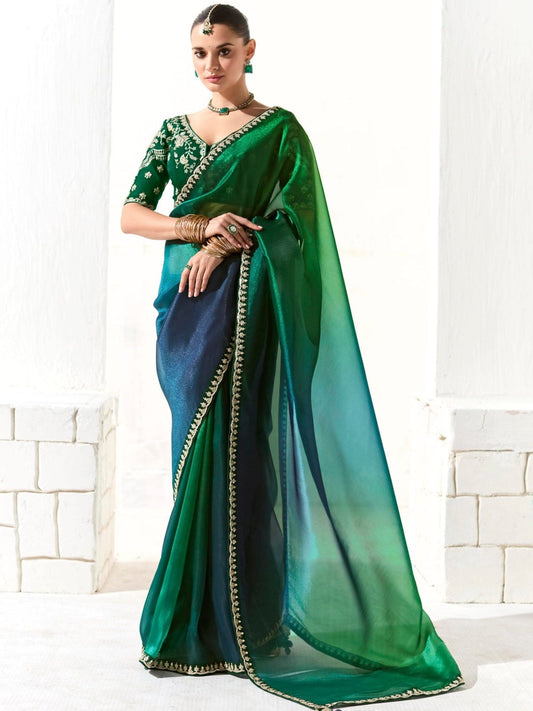 Dhiyona KM Women Peacock-Inspired Tissue Silk Organza Saree With Epeacock-Inspired Tissue Silk Organza Sareembroidered Blouse