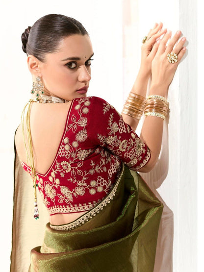 Dhiyona KM Women Mahendi Green Tissue Silk Saree With Red Blouse “ Inspired By Tradition & Bold Elegancemahendi Green Tissue Silk Saree With Red Blouse