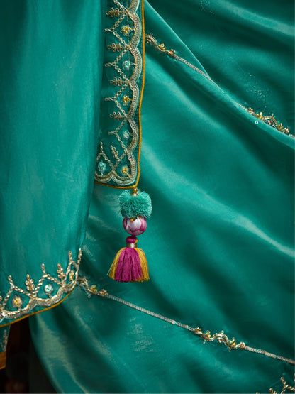Dhiyona KM Women Teal Designer Organza Saree With Handcrafted Embroidered Border “ Bold, Elegant, Unforgettableteal Green Designer Organza Silk Saree