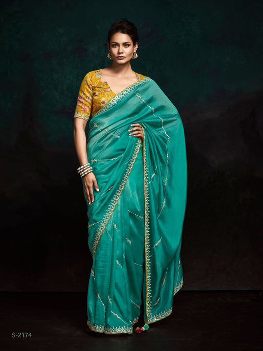 Dhiyona KM Women Teal Designer Organza Saree With Handcrafted Embroidered Border “ Bold, Elegant, Unforgettableteal Green Designer Organza Silk Saree
