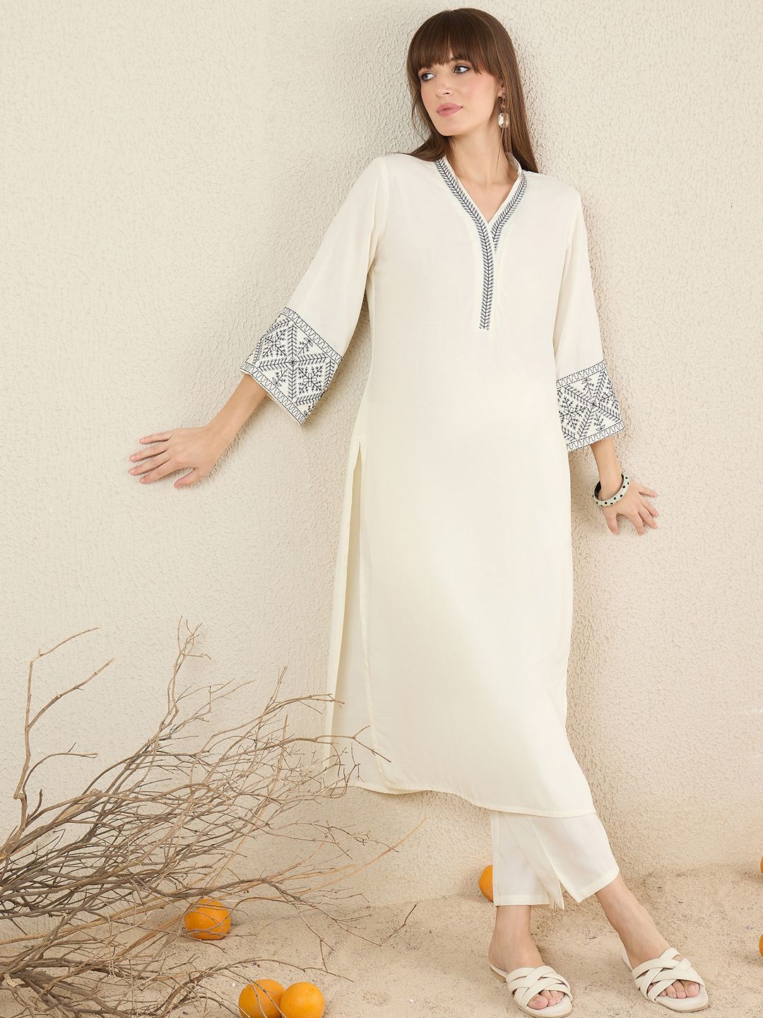 Women Solid Embroidered Kurta with Trousers