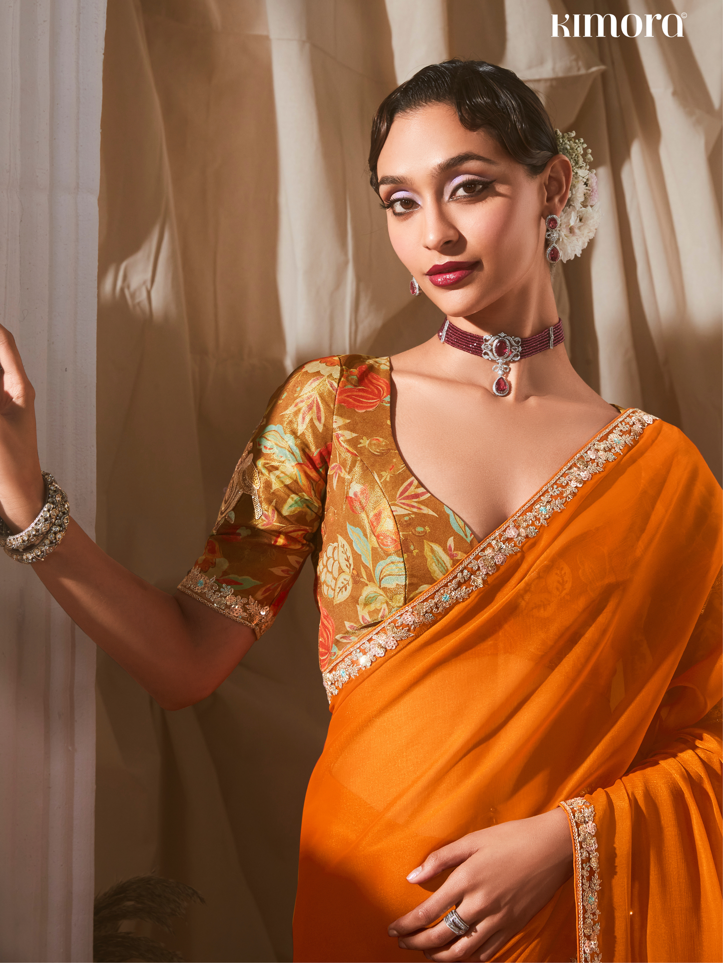 Dhiyona KM Women Orange Saree: Effortless Elegance For Every Occasion