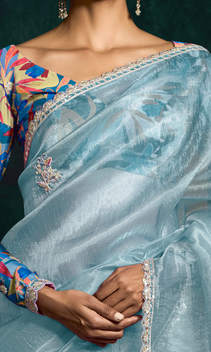 Dhiyona KM Women Sky Blue Designer Organza Saree  “ A Blush Of Elegance