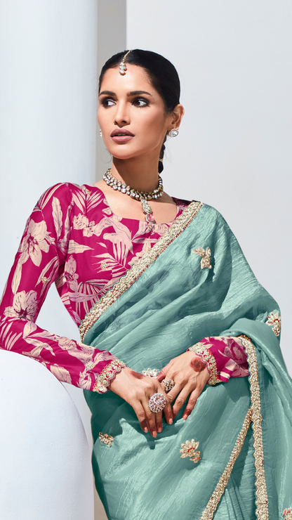 Dhiyona KM Women Teal Pure Tissue Silk Saree With Crushed Finish & Contrasting Red Blouse