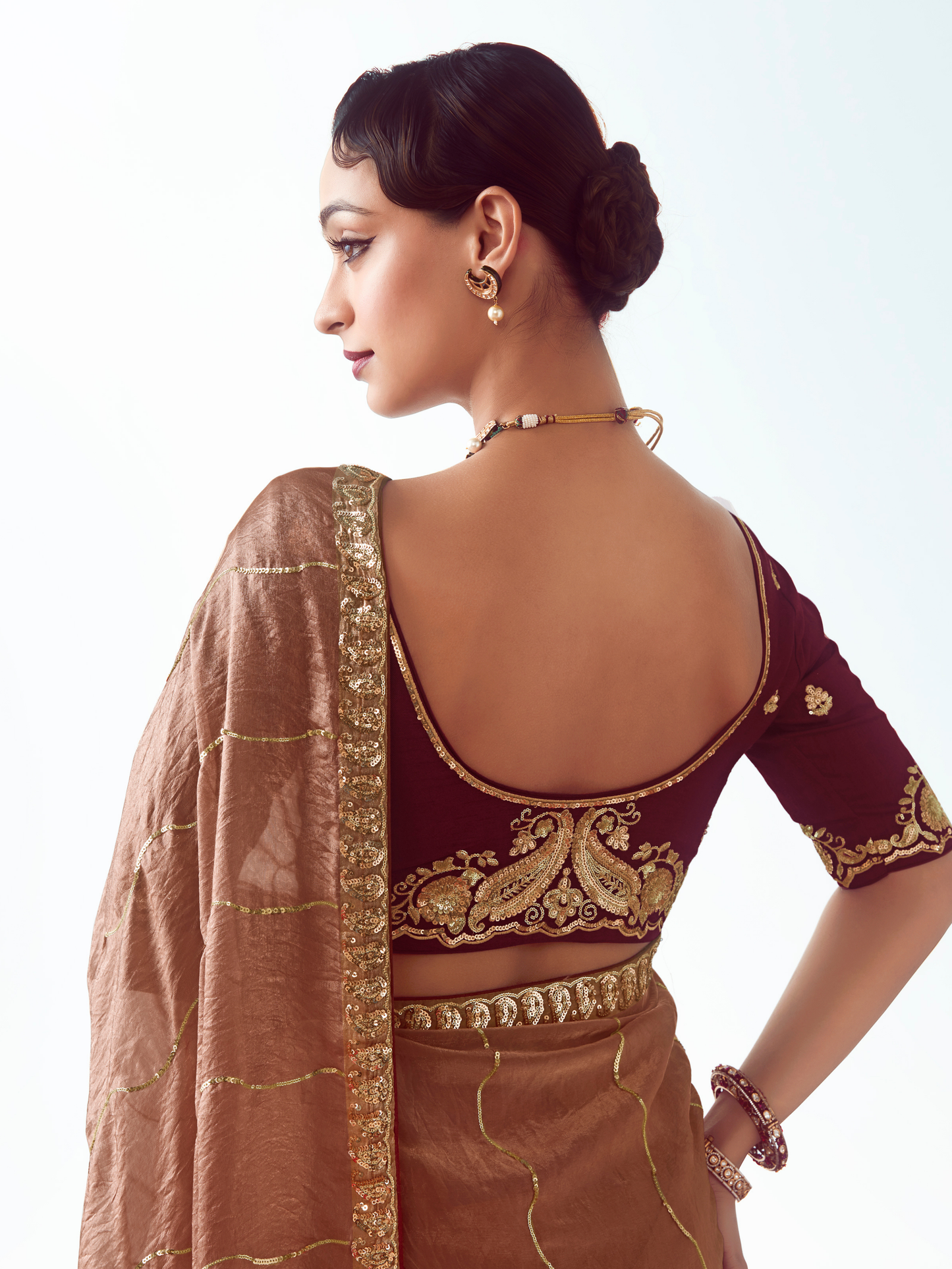 Dhiyona KM Women Rose Gold Silk Saree