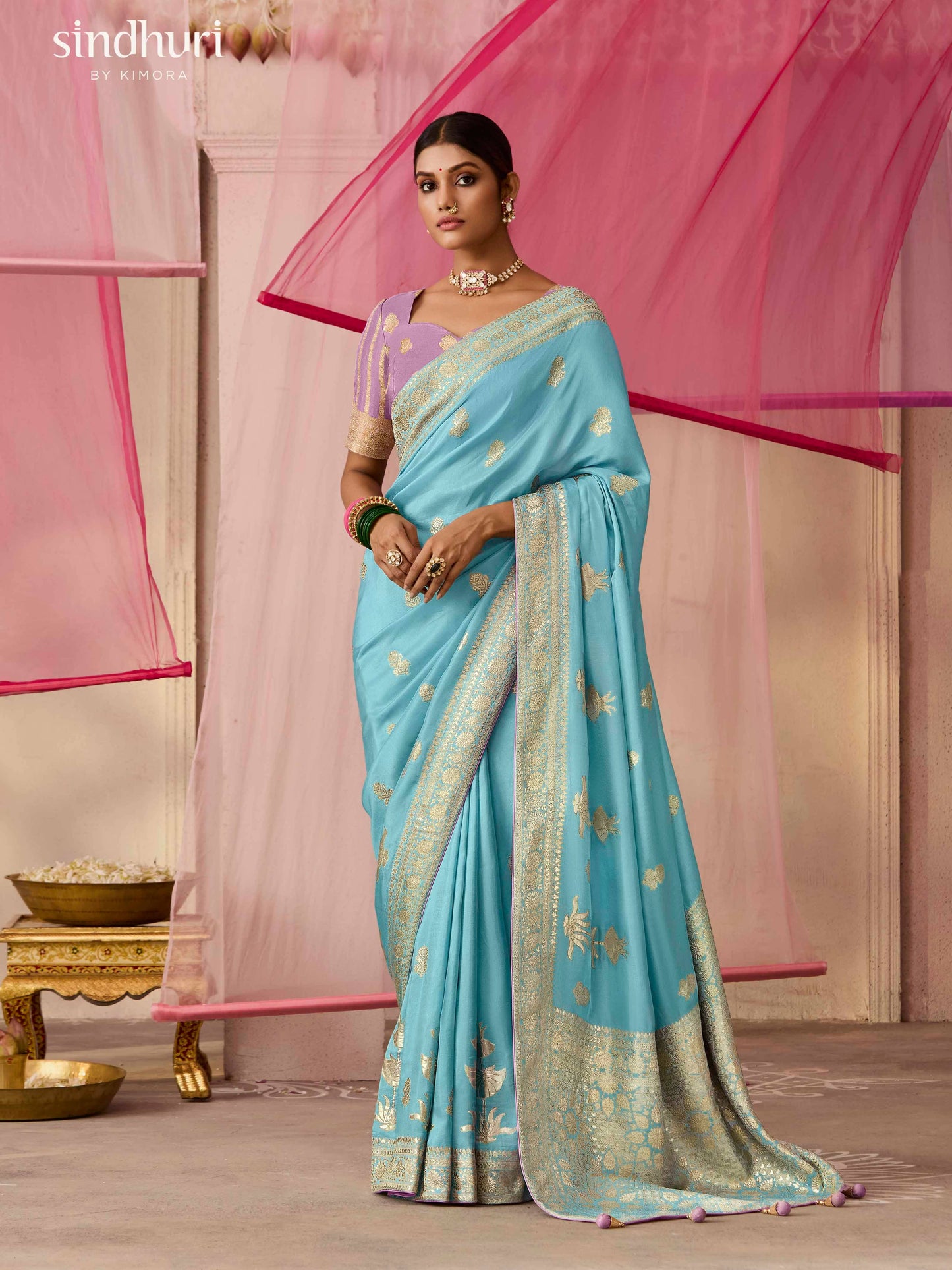 Dhiyona KM Women Elegant Aqua Blue Dola Silk Saree With Purple Golden Work Blouse