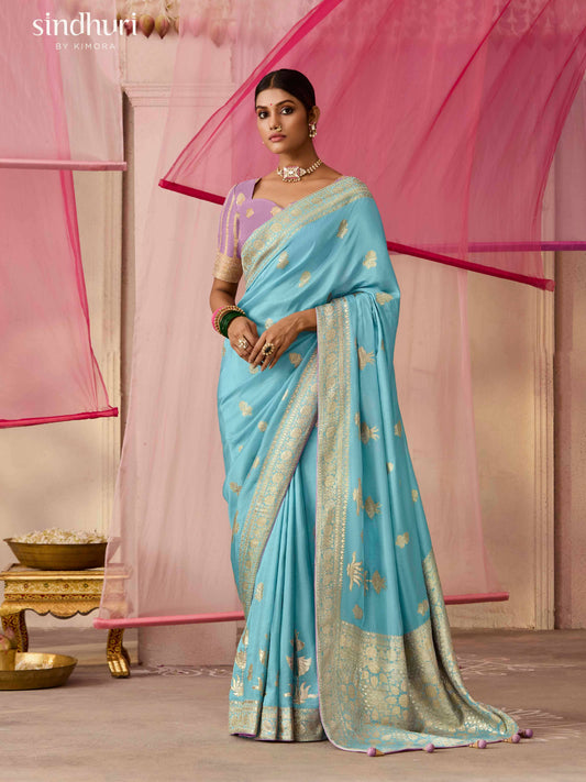 Dhiyona KM Women Elegant Aqua Blue Dola Silk Saree With Purple Golden Work Blouse