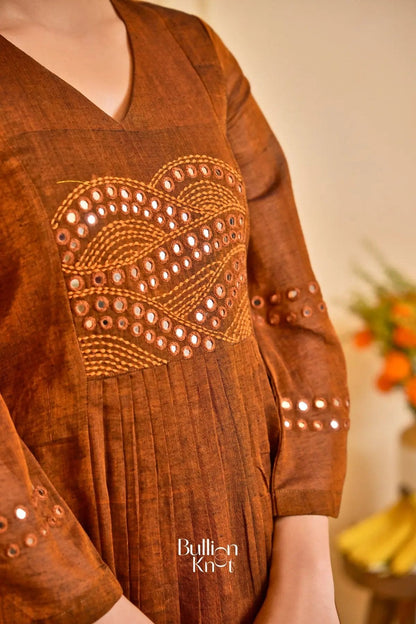 Side view of Saanchi Kurta Set in Peacock Blue, highlighting the pleated design and gold-bordered hem. A must-have traditional outfit from bullionknot.