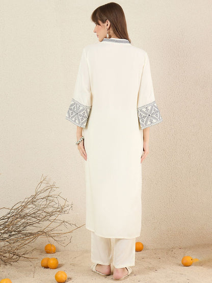 Women Solid Embroidered Kurta with Trousers