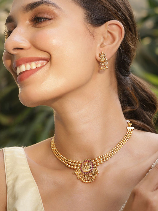 Dhiyona RJ Women's 22K Gold Plated Ruby Studded Gold Beaded Goddess Laxmi Motif Temple Jewellery Set