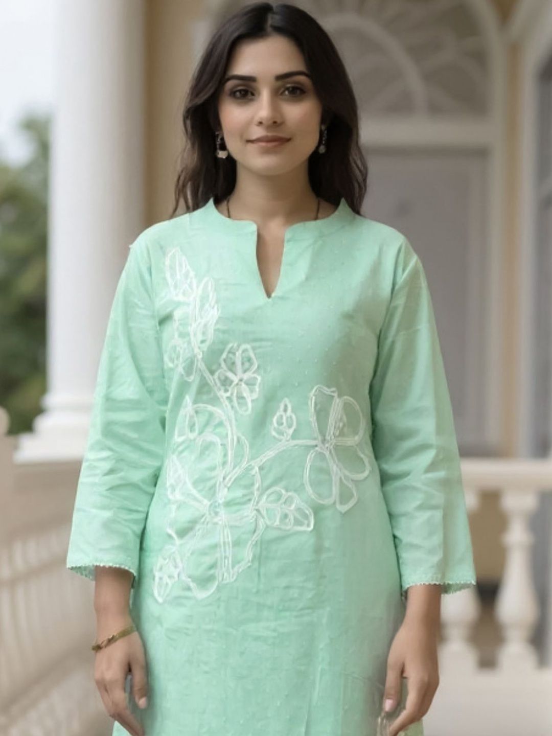 Women Floral Embroidered Cotton Kurta with Trousers