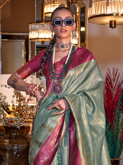 Women's Tissue Pink Woven Design Designer Saree With Blouse Piece