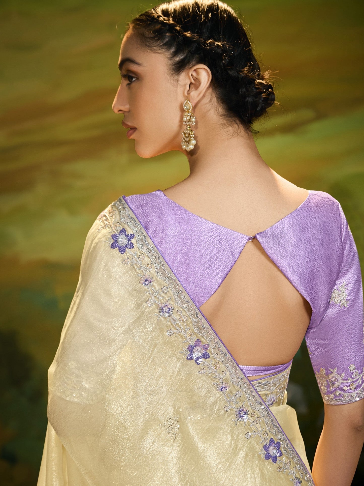 Dhiyona KM Women Pastel Yellow Saree With Silver Embroidery & Purple Blouse