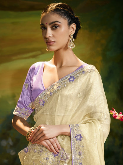 Dhiyona KM Women Pastel Yellow Saree With Silver Embroidery & Purple Blouse