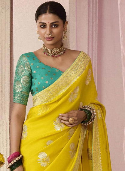 Dhiyona KM Women Yellow Dola Silk Saree With Sea Green Golden Embroidered Blouse