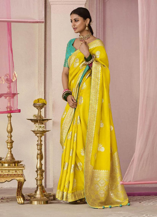 Dhiyona KM Women Yellow Dola Silk Saree With Sea Green Golden Embroidered Blouse